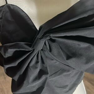 spaghetti strap with large bow across the chest adjustable straps